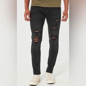 Ripped faded skinny black jeans